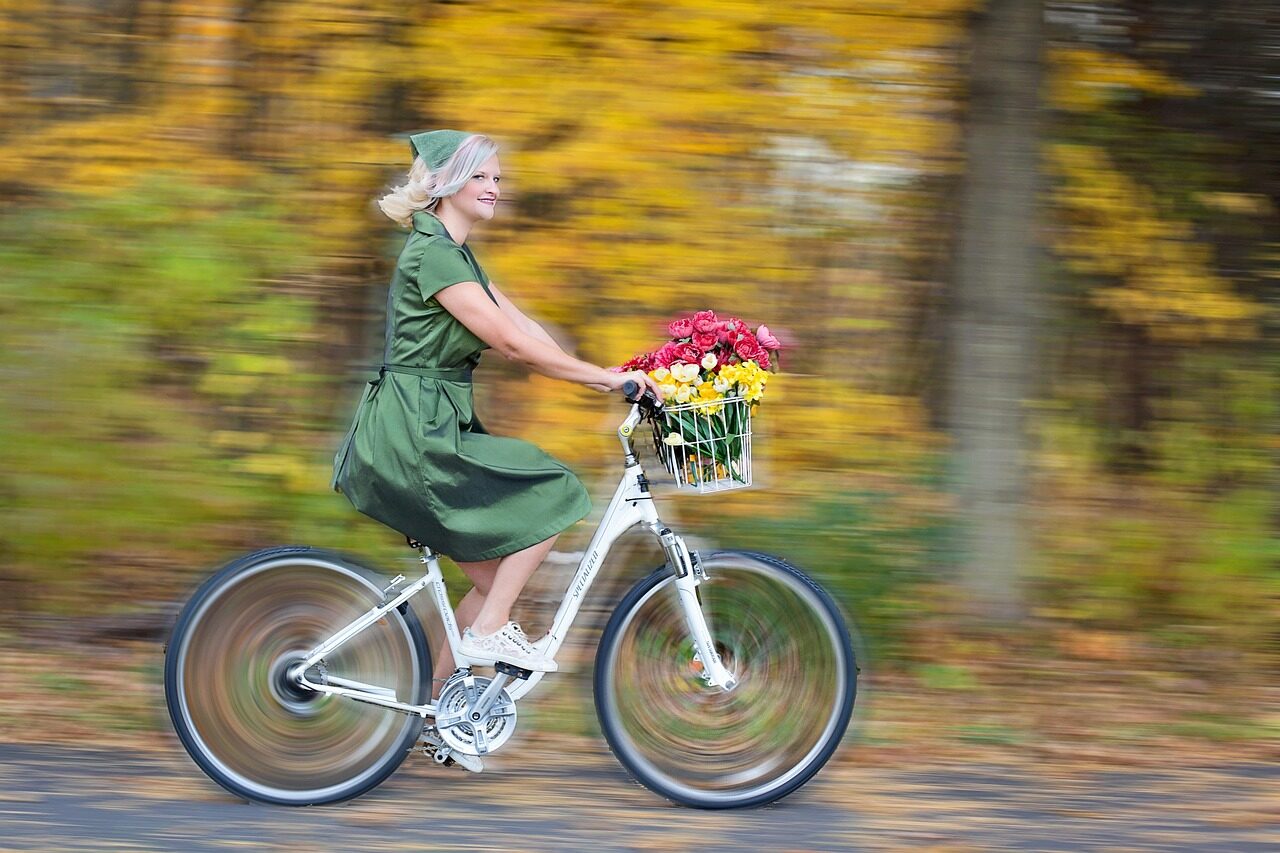 a female is cycling taking flowers